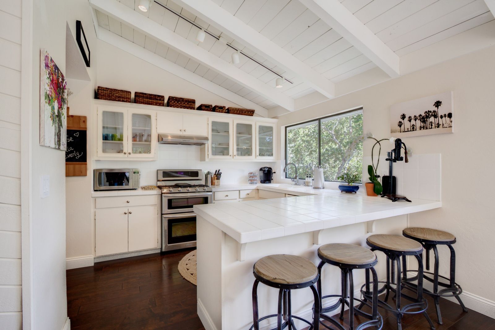 Kitchen in 2014 with Restoration Hardware bar stools, Serena & Lily rug, new oven and fresh cabinet hardware.