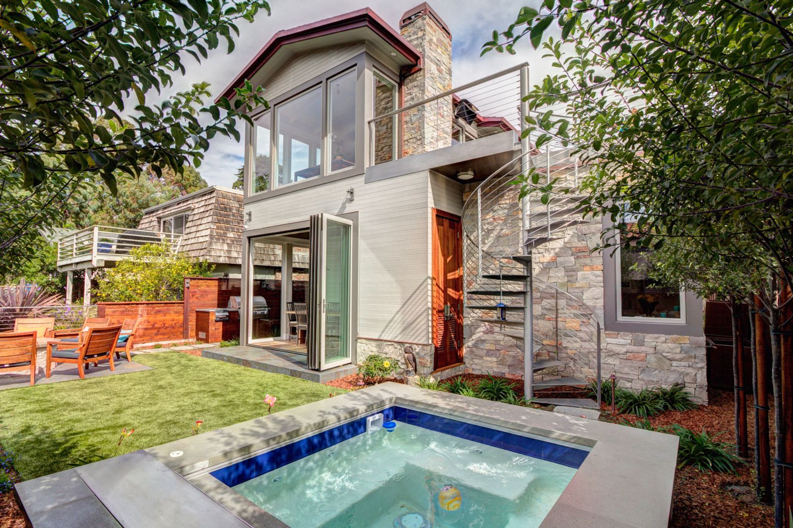 Spiral Staircase connecting roof deck to backyard